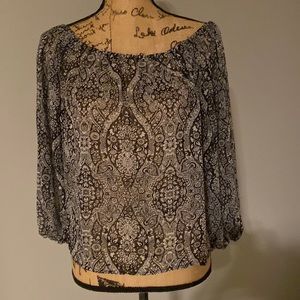 Olivaceous black/white pattern top.  Sheer with elastic top & sleeves cuff.